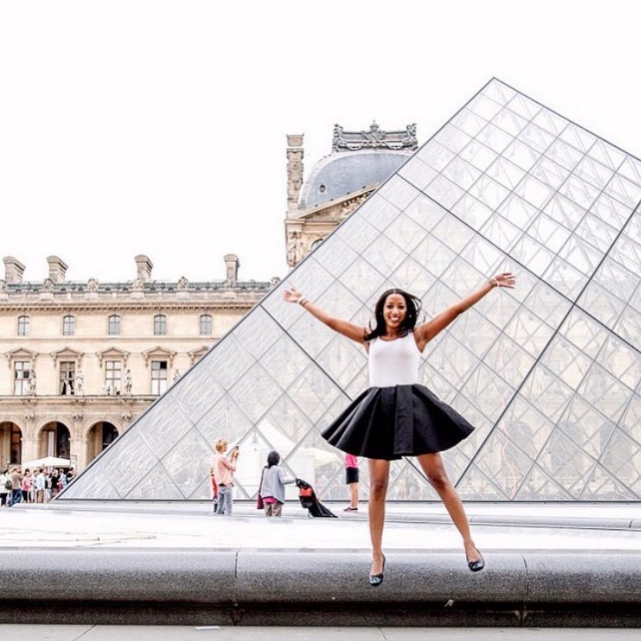 The 15 Best Black Travel Moments You Missed This Week: Fun Loving By The Louvre in Paris
